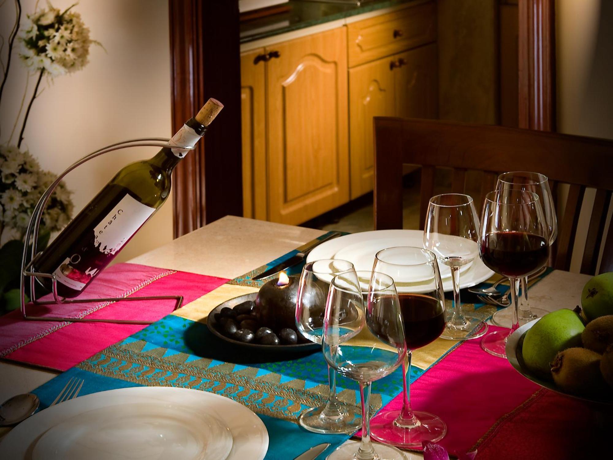 The Lalit Mumbai Hotell Eksteriør bilde A wine bottle and glasses